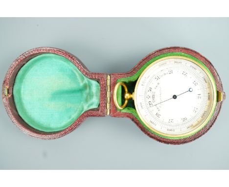 A late Victorian pocket combined magnetic compass and aneroid barometer / altimeter, in red leather covered case, 5 cm exclud