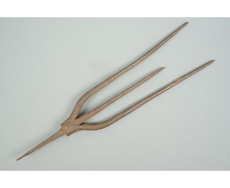 An antique wrought iron trident head, 34 cm