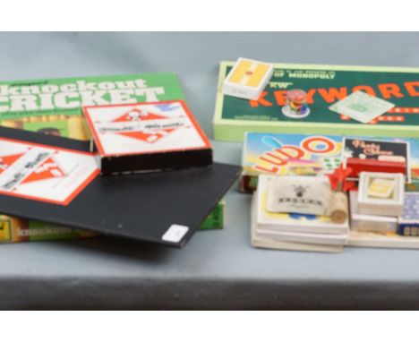 Vintage games including Monopoly, Knockout Cricket, playing cards, poker dice, Rubik's cube etc.