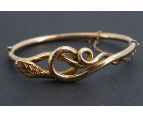 A Victorian yellow metal serpent-form hinged bangle, 6.5 x 5.5 cm(Condition: no issues)