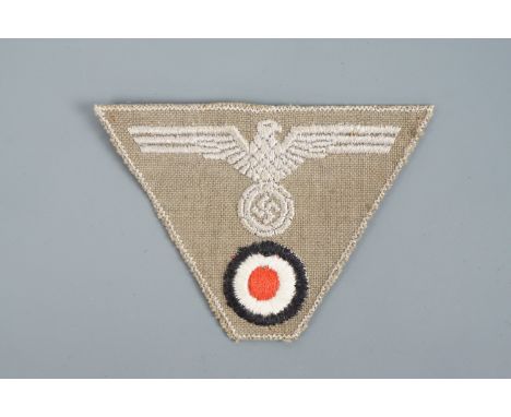 A late-War German Third Reich army trapezoidal cap badge