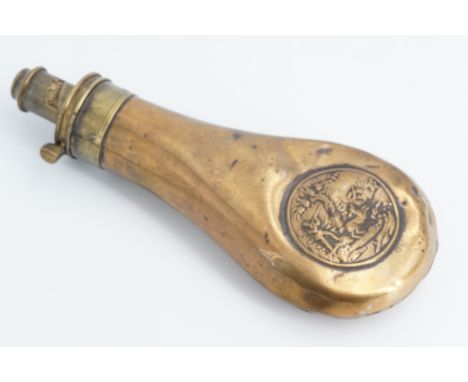 A Victorian copper powder flask, the bag shaped body faced with an embossed circular plaque decorated with a hunting vignette