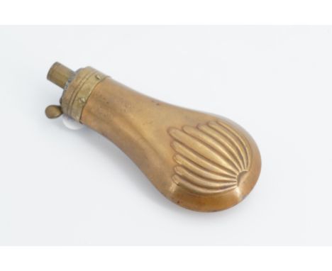 An early 19th Century copper and brass pistol powder flask, the bag shaped body decorated in a relief anthemion pattern, 12 c