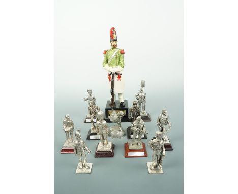 A quantity of electroplate and die-cast military figures including Victorian soldiers, a Second World War RAF pilot and Gulf 
