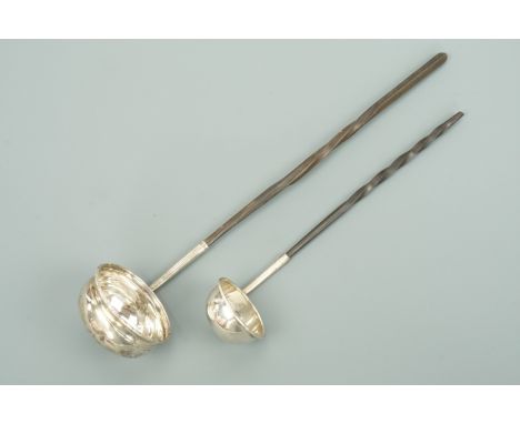 A Georgian white metal toddy ladle with baleen handle, inset with a James II 1686 silver coin, unmarked, together with a Vict