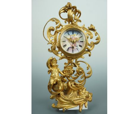 A late 19th Century Rococo gilt metal table clock, having an un-attributed spring-driven movement with pictorial enamelled fa