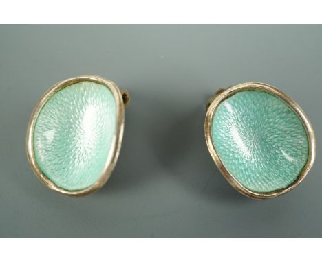 A pair of 1960s Norwegian enamelled white metal clip earrings, each of concave shell-like form, pale blue basse taille enamel