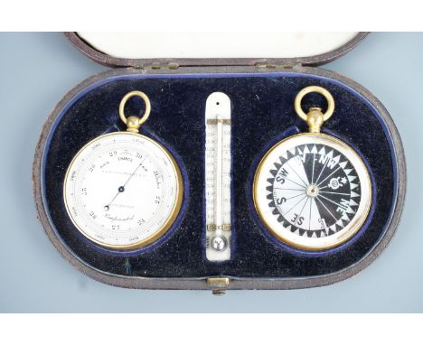 A late Victorian cased pocket magnetic compass and aneroid barometer / altimeter, the fitted red leather covered case incorpo