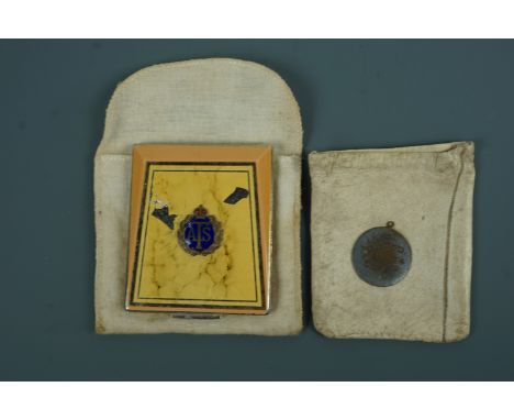 A Second World War ATS powder compact together with an identity disc