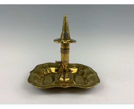 A Georgian brass chamber stick with dousing cone