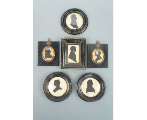 A family group of six 19th Century painted silhouettes, each incorporating a manuscript annotation regarding each sitter, inc