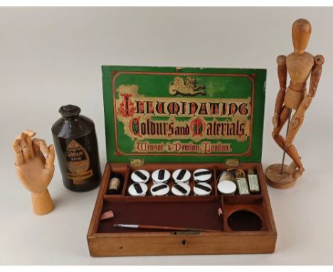 An early 20th century mahogany paint box 'Illuminating Colours and Materials' by Windsor &amp; Newton London, the divisioned 
