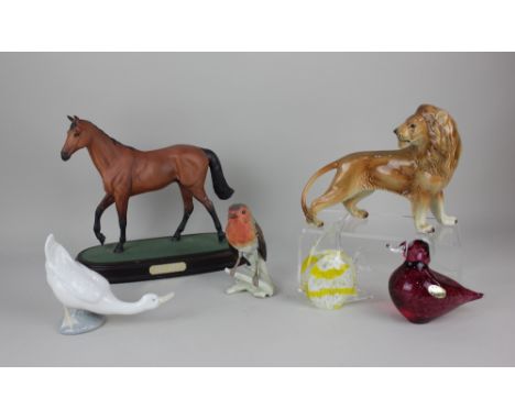 A Beswick model of steeplechaser Red Rum mounted on a plinth, together with a Goebel model of a robin, Western Germany model 