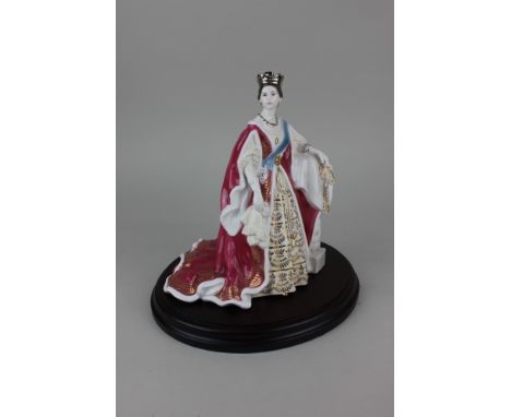 A Royal Worcester porcelain limited edition figure of Queen Victoria no. 235 of 4,500 21.5cm high, with wooden stand and cert