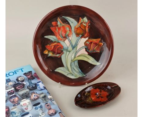 A Moorcroft pottery Red Tulips pattern plate 26cm diameter, boxed, together with a Moorcroft pottery Red Hibiscus ashtray 16c