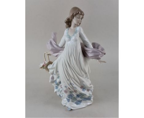 A Lladro porcelain figure 5898 'Spring Splendor' of a lady with a basket of flowers 30cm high, boxed
