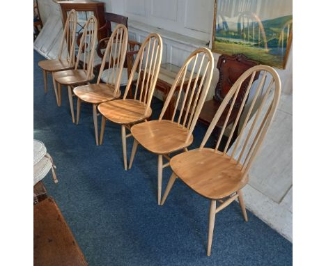 A set of six Ercol light wood dining chairs with slatted arched backs