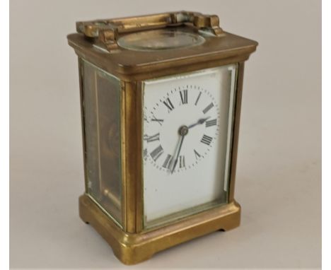 A French brass and bevelled glass cased carriage clock by R &amp; Co. Paris, 14cm high, with key