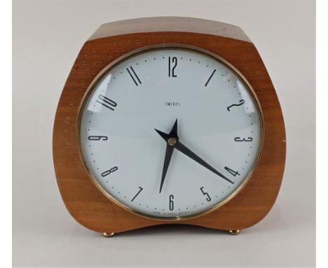 A mid 20th century Smiths walnut mantle clock, striking on a gong, 19cm high, with key