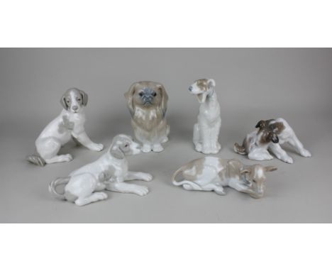 A Lladro porcelain model of a Pekinese 16cm high, a terrier 9cm high, and a calf 6cm high (a/f), together with three Nao porc