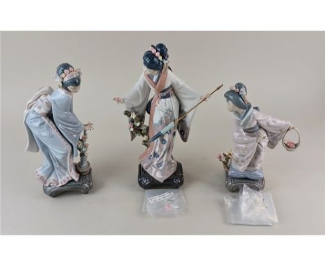 Three Lladro porcelain figures of geishas comprising 1451 'Teruko' of a geisha holding a parasol 27.5cm high, boxed, together