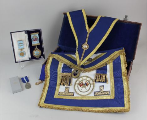 A silver gilt and enamel masonic medal, Sackville Lodge no.1619, cased, together with two metal Masonic medals, and a case of