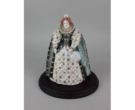 A Royal Worcester porcelain limited edition figure of Queen Elizabeth I no. 335 of 4,500 24cm high, with wooden stand and cer