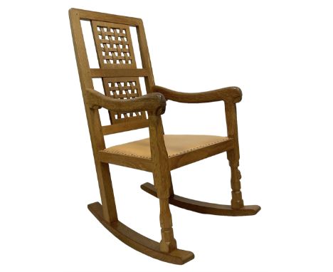 Mouseman - oak rocking armchair, double pierced and carved lattice back, upholstered in tan leather with stud work, octagonal