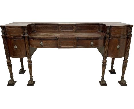 An impressive Irish George III mahogany sideboard, raised back fitted with sliding compartments and two drawers with reed car