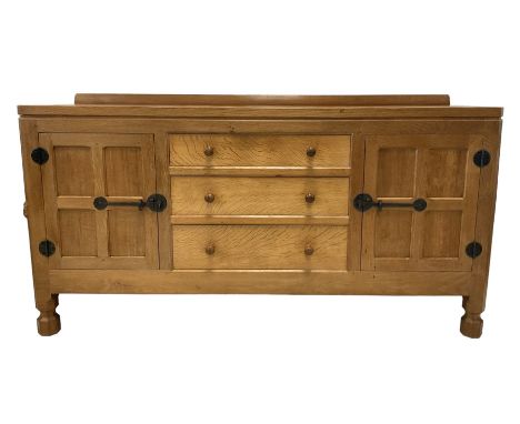 Mouseman - adzed oak sideboard, raised back over rectangular top, fitted with three central graduating drawers flanked by two