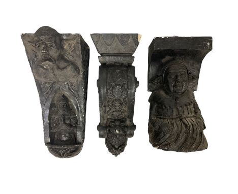 Medieval design ebonised corbel, the top section with a moulded scaly grotesque with mouth agape and pointed ears, the lower 