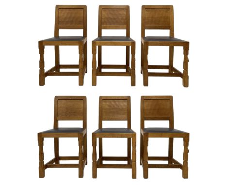 Mouseman - set six oak dining chairs, adzed panelled back, upholstered in navy blue leather with studded band, the octagonal 