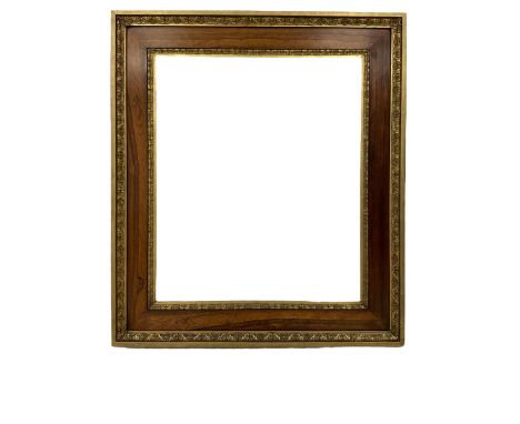 19th century rosewood and gilt stepped rectangular frame, the central rosewood panel flanked by repeating moulded cartouche a