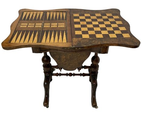 19th century figured walnut games table, the shaped fold-over swivel top revealing chess, backgammon and cribbage boards, fri