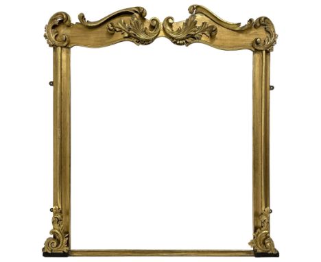 19th century ornate giltwood framed overmantel mirror, the moulded frame mounted by scrolled foliage carvings to the pediment