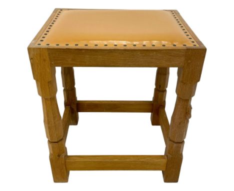 Mouseman - oak stool, tan leather upholstered seat with studded band, on octagonal supports joined by plain stretchers, carve