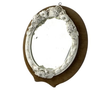 Victorian Royal Worcester glazed white Parian mirror, of oval form with moulded frame applied with flowers and foliage, with 