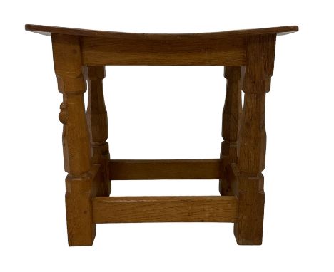 Mouseman - adzed oak joint stool, dished top on four octagonal supports united by stretchers, carved with mouse signature, by