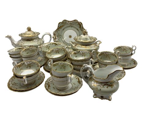 Early 19th century tea service of Rockingham design, comprising a teapot, sucrier on stand, two serving plates, slop bowl, mi