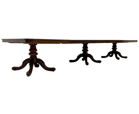 Early Victorian mahogany extending triple pillar dining table, rounded rectangular top with plain skirt, triple turned pedest