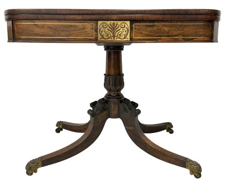 Early Victorian rosewood card table, rectangular swivel and fold-over top with rounded corners, the frieze with inlaid brass 