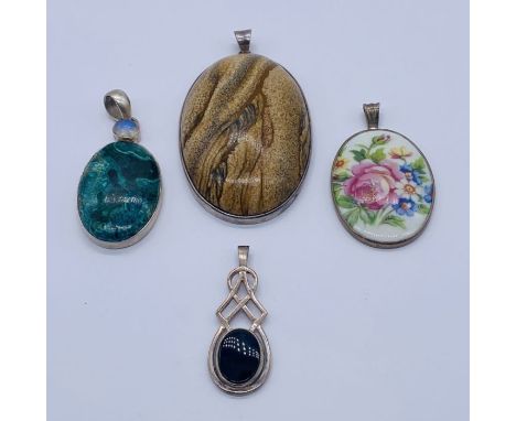 Four 925 silver pendants set with malachite, onyx etc.