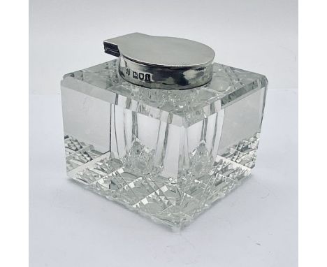 A hallmarked silver topped inkwell, Birmingham 1908