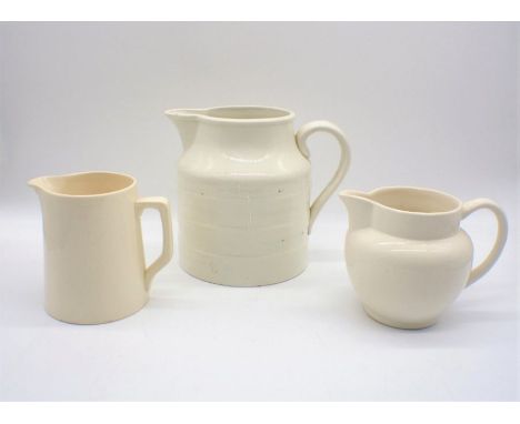 A large white ceramic jug, marked 'E II R, 1953, ADAMS', along with two others similar.