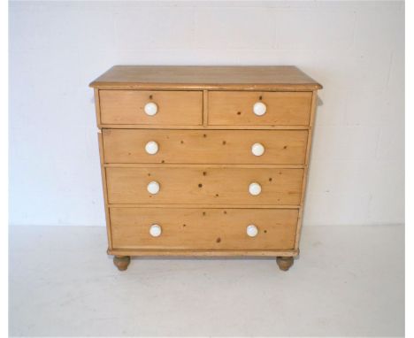 A Victorian pine chest of five drawers, with ceramic handles, length 106cm, height 105.5cm, depth 51cm.