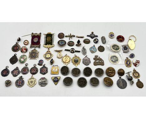 A collection of vintage badges and medallions including military, Buffaloes etc - small amount of silver 