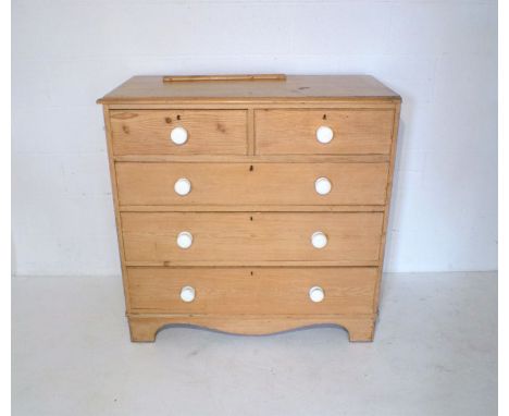 A Victorian pine chest of five drawers, with ceramic handles, length 109cm, height 106.5cm.