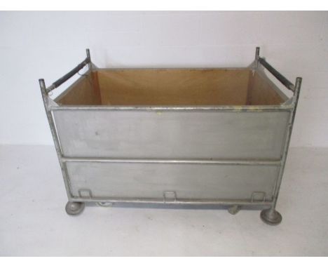 An industrial metal framed bobbin trolley from Axminster Carpets