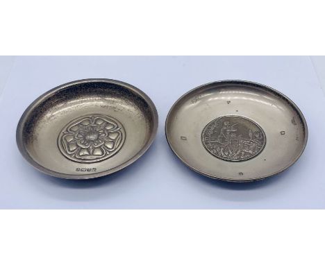 Two hallmarked silver dishes, one with a central plaque depicting a hunting scene, the other depicting the Yorkshire Rose, to