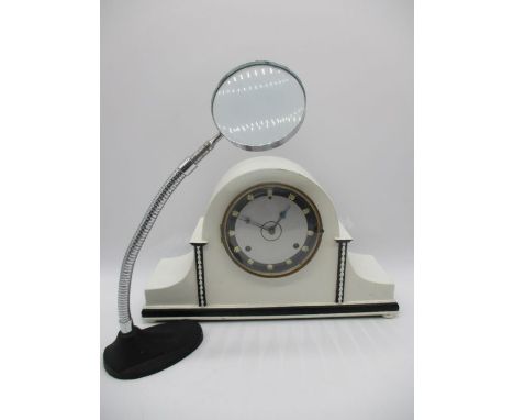A white painted Westminster chime mantle clock along with an adjustable magnifying glass on stand